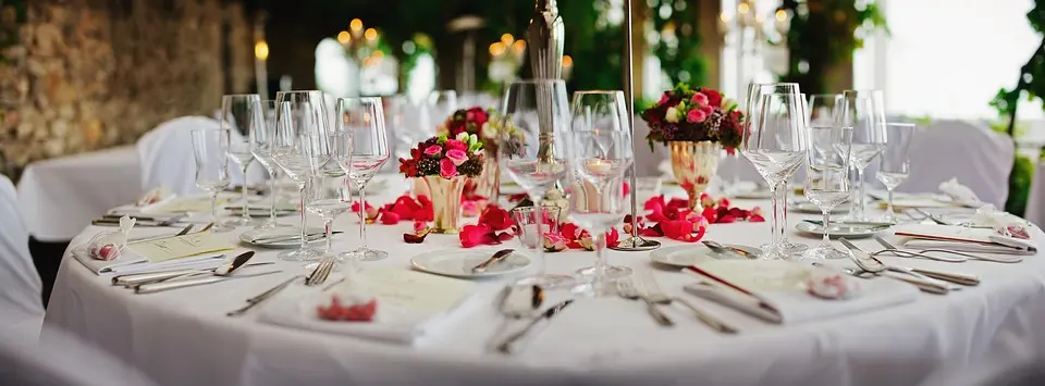 Table decorated with red flowers