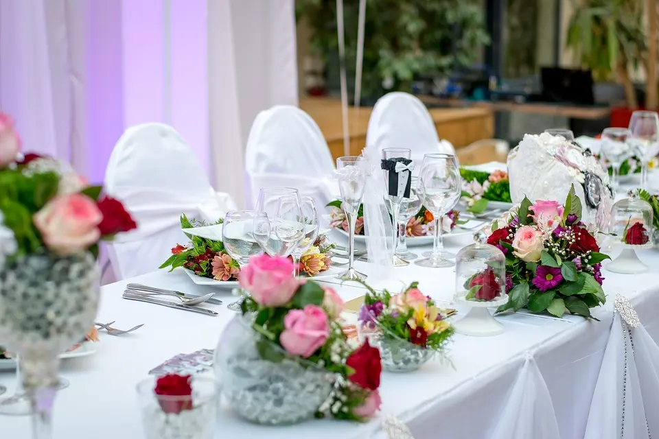 Dinner table set with flowers