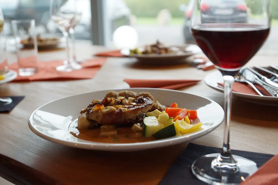 Plated dinner with red wine